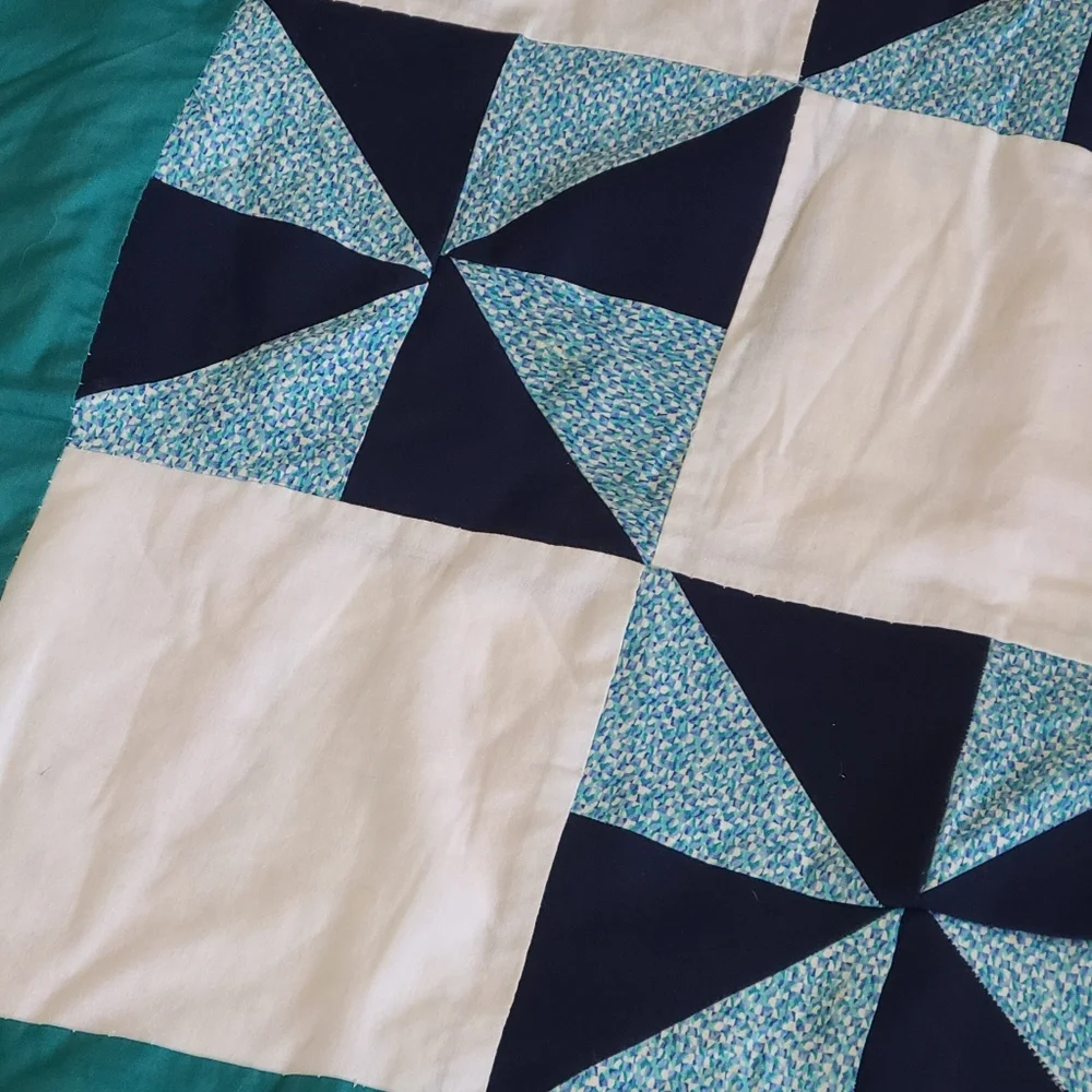Hand stitched pinwheel quilt